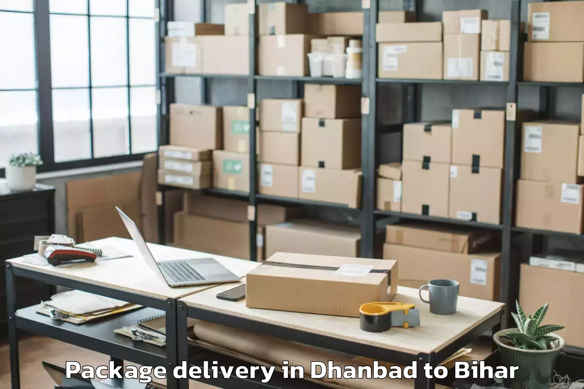 Dhanbad to Rajaun Package Delivery